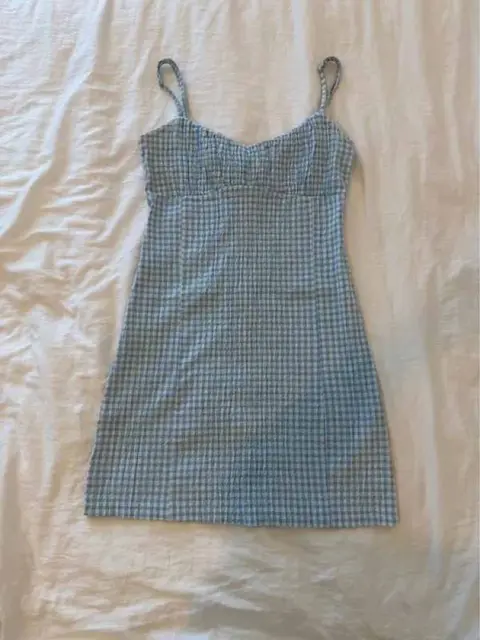 Gingham jurk, de telefoonfoto